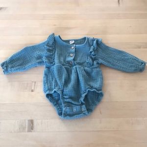 Adorable button front ruffle feature one piece.